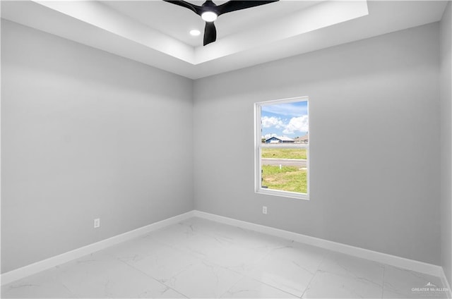 1326 S 9th St, Alamo, TX 78516 - empty room with baseboards, light marble finish flooring, a raised ceiling, and recessed lighting