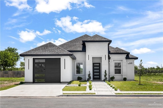 1326 S 9th St, Alamo, TX 78516 - view of front of house featuring an attached garage, driveway, and roof with shingles