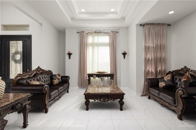 living area featuring recessed lighting and marble finish floor