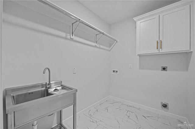 laundry area featuring cabinet space, baseboards, hookup for a washing machine, marble finish floor, and electric dryer hookup