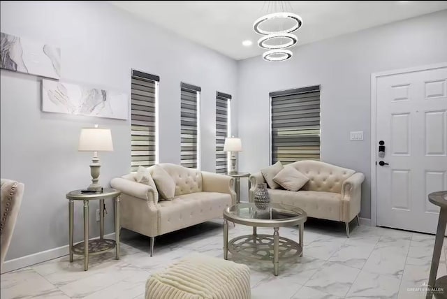 sitting room with marble finish floor, baseboards, a chandelier, and recessed lighting