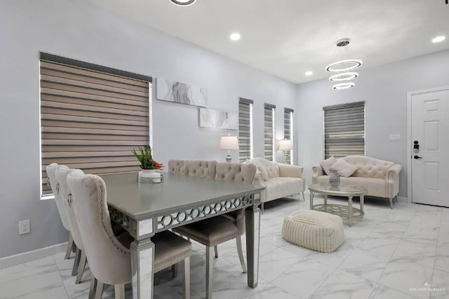 dining room featuring marble finish floor, baseboards, a chandelier, and recessed lighting