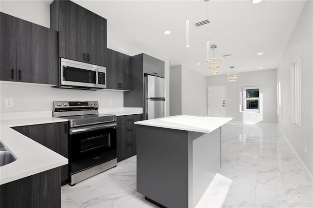 kitchen with stainless steel appliances, marble finish floor, light countertops, and modern cabinets