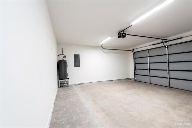 garage featuring electric panel, water heater, and a garage door opener