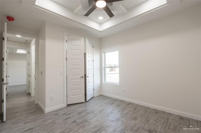 unfurnished bedroom with light wood-type flooring and ceiling fan