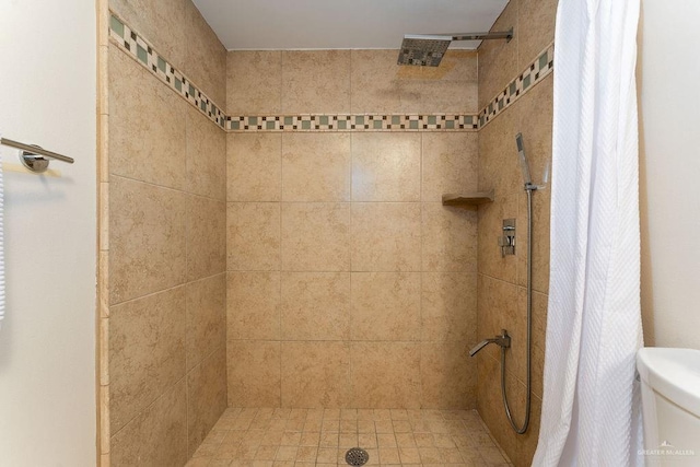 bathroom with toilet and walk in shower