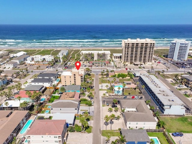 bird's eye view featuring a beach view and a water view