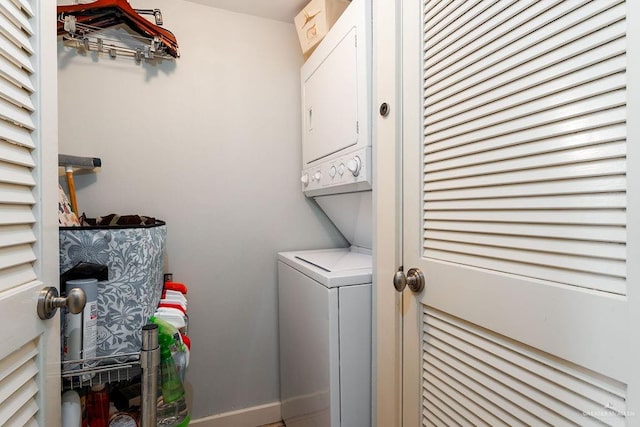 clothes washing area featuring stacked washer and dryer