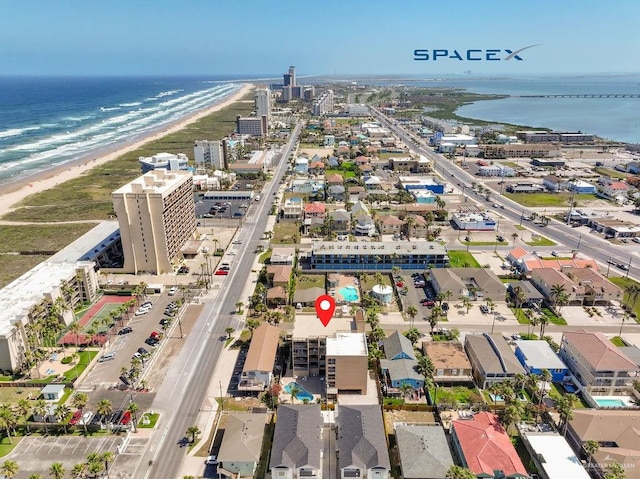 bird's eye view featuring a view of the beach and a water view