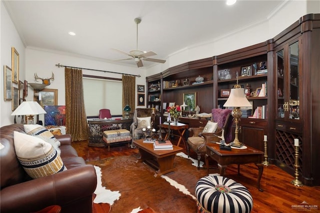 living area with ceiling fan, ornamental molding, wood finished floors, and recessed lighting