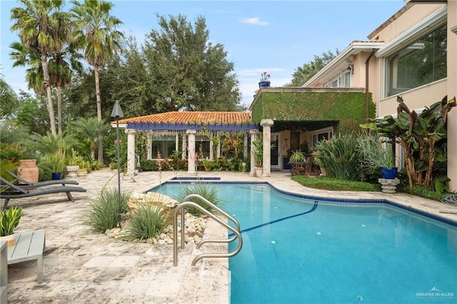 outdoor pool featuring a patio