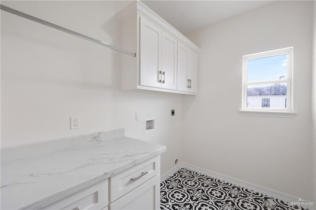 9817 Heights, Harlingen, TX 78552 - clothes washing area featuring hookup for an electric dryer, cabinet space, baseboards, and hookup for a washing machine