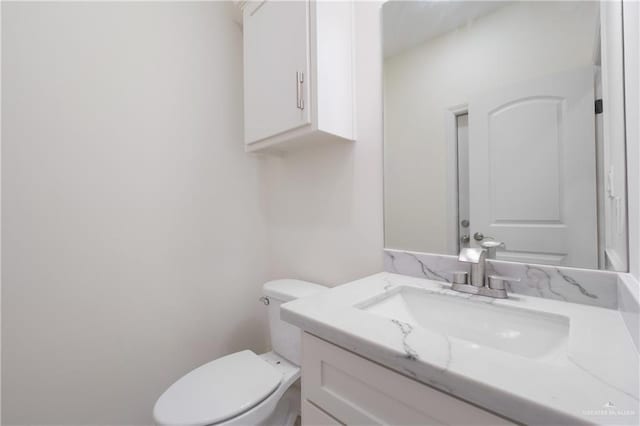 9817 Heights, Harlingen, TX 78552 - bathroom featuring toilet and vanity