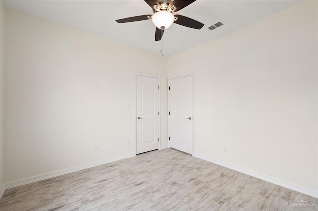 9817 Heights, Harlingen, TX 78552 - unfurnished room with light wood finished floors, baseboards, and ceiling fan
