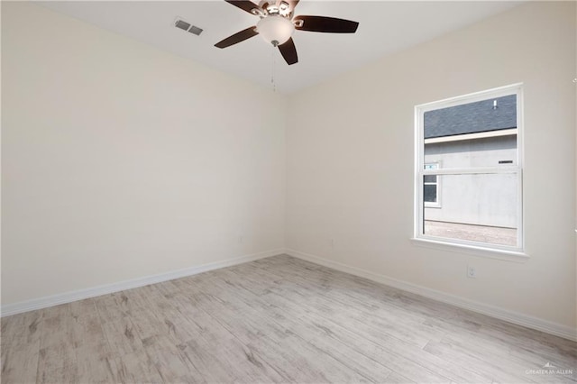 9817 Heights, Harlingen, TX 78552 - unfurnished room with wood finished floors, a ceiling fan, and baseboards