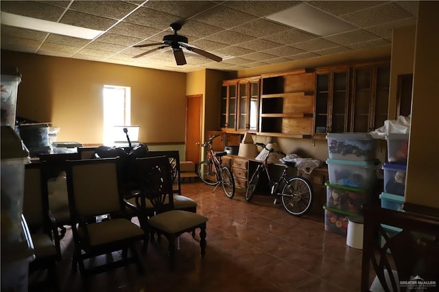 12431 Ware Rd, Edinburg, TX 78541 - miscellaneous room featuring a paneled ceiling, dark tile patterned flooring, and ceiling fan