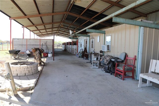 12431 Ware Rd, Edinburg, TX 78541 - view of patio with an exterior structure, cooling unit, an outdoor structure, and an outdoor fire pit