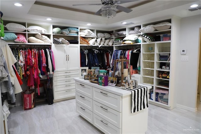 12431 Ware Rd, Edinburg, TX 78541 - spacious closet featuring visible vents, a raised ceiling, and a ceiling fan