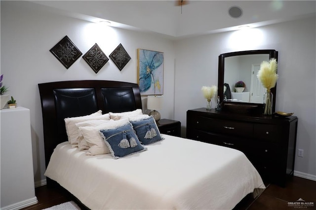 12431 Ware Rd, Edinburg, TX 78541 - bedroom with baseboards and dark wood-style flooring