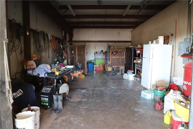 12431 Ware Rd, Edinburg, TX 78541 - garage with a workshop area and freestanding refrigerator