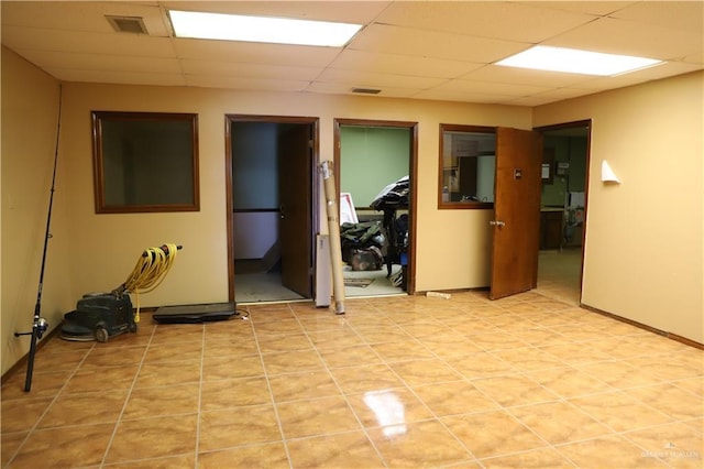 12431 Ware Rd, Edinburg, TX 78541 - empty room featuring light tile patterned floors, a drop ceiling, and visible vents