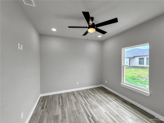 unfurnished room featuring ceiling fan and light hardwood / wood-style flooring