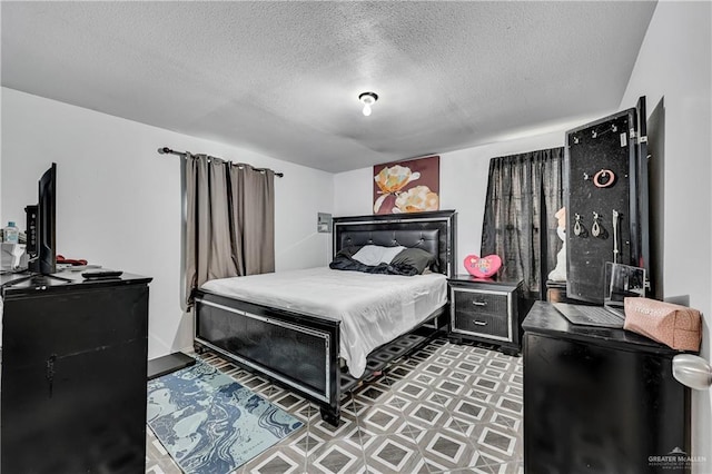 bedroom featuring a textured ceiling