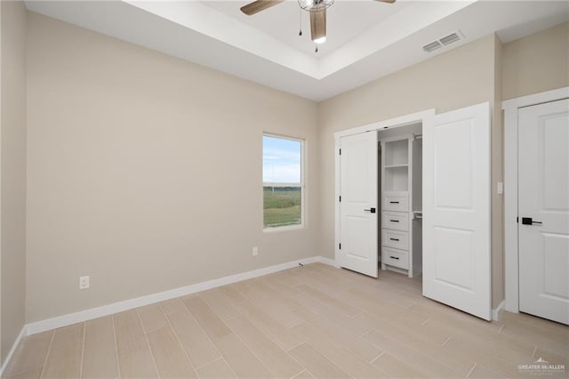 unfurnished bedroom featuring light hardwood / wood-style flooring and ceiling fan