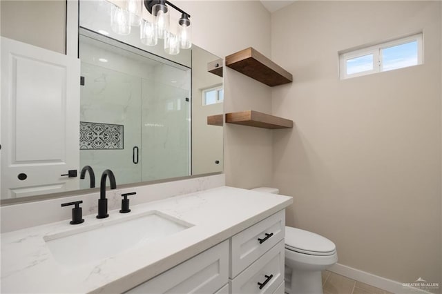 bathroom with tile patterned floors, vanity, toilet, and an enclosed shower