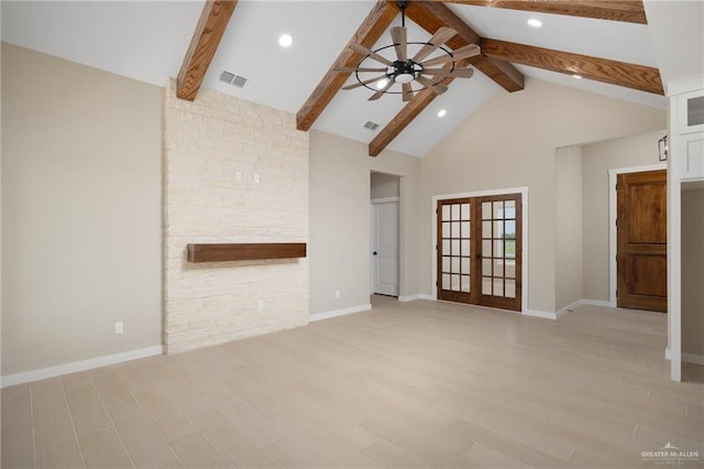 unfurnished living room featuring french doors, high vaulted ceiling, light hardwood / wood-style floors, and beamed ceiling