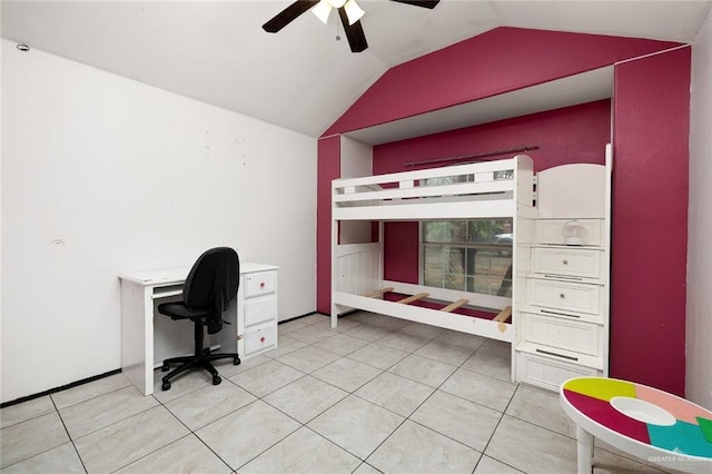 tiled bedroom with lofted ceiling and ceiling fan