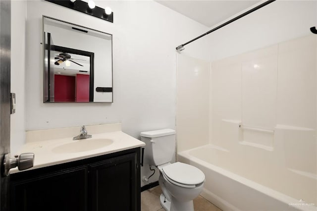 full bathroom featuring tile patterned flooring, vanity, bathtub / shower combination, and toilet