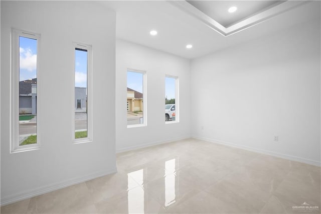 unfurnished room with light tile patterned floors