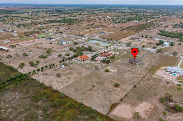 birds eye view of property featuring a rural view