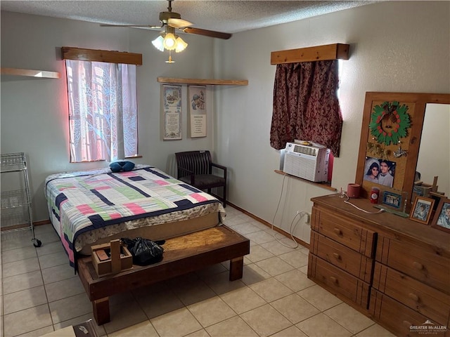 tiled bedroom with a textured ceiling, ceiling fan, and cooling unit