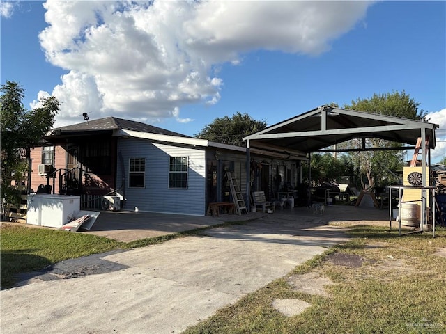 exterior space with a carport