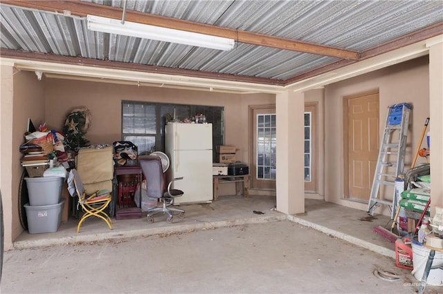 garage with white fridge