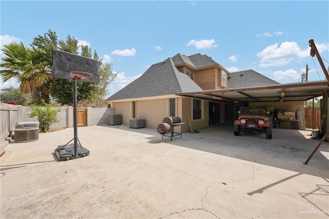 exterior space featuring a carport and central air condition unit