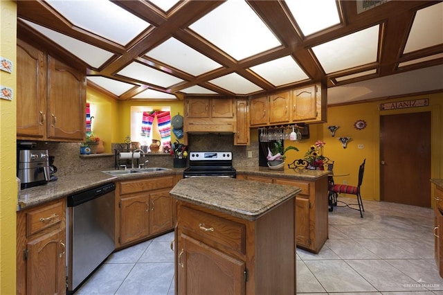 kitchen featuring a center island, sink, stainless steel appliances, and tasteful backsplash