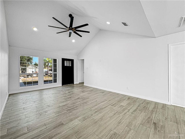 unfurnished living room with ceiling fan, high vaulted ceiling, and light hardwood / wood-style flooring