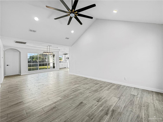 unfurnished living room featuring ceiling fan, light hardwood / wood-style flooring, and high vaulted ceiling