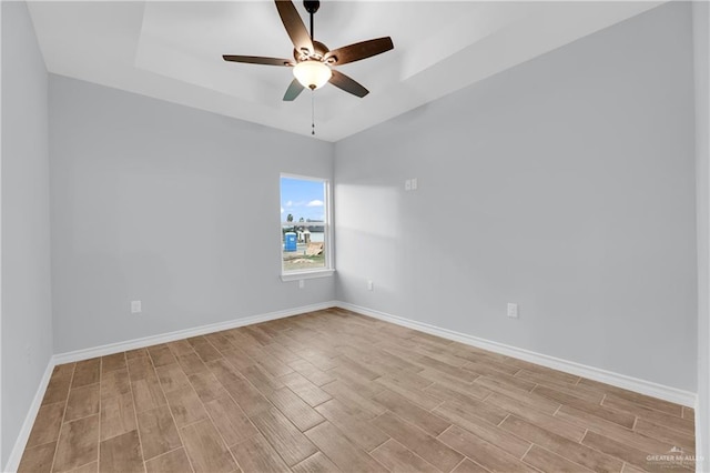 spare room with ceiling fan and light hardwood / wood-style floors