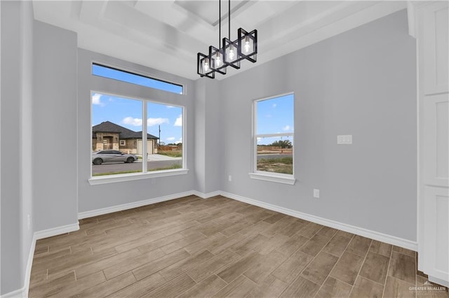 unfurnished dining area with light hardwood / wood-style floors and a notable chandelier