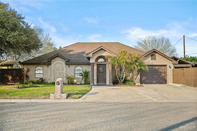 ranch-style home featuring a garage