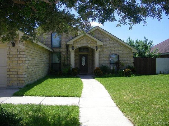 704 N Drennan St N, Edinburg, TX 78541 - view of front of house featuring stone siding
