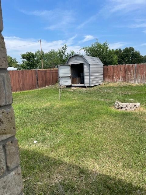 704 N Drennan St N, Edinburg, TX 78541 - view of yard featuring a shed and an outdoor structure