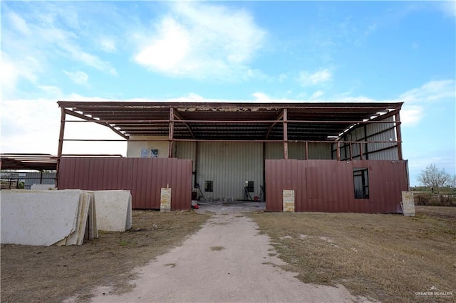 view of home's exterior with an outbuilding