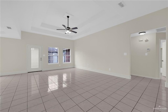 1507 Vatia Blvd, Mission, TX 78572 - unfurnished room featuring light tile patterned flooring, ceiling fan, and a raised ceiling