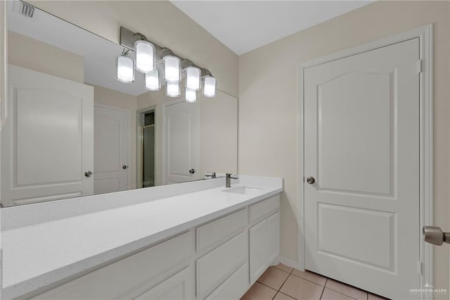 1507 Vatia Blvd, Mission, TX 78572 - bathroom with vanity, tile patterned flooring, and a shower with door