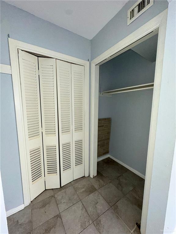 unfurnished bedroom featuring a closet